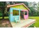 The colorful pool cabana features a tropical-themed bar area and outdoor seating at 1851 Harvest Way, Loganville, GA 30052