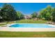 Large in-ground pool with surrounding patio and fenced backyard, perfect for outdoor enjoyment at 1851 Harvest Way, Loganville, GA 30052