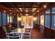 Enclosed porch with outdoor seating and string lights at 1851 Harvest Way, Loganville, GA 30052