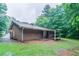 Back of house features horizontal siding and a cozy, covered patio at 604 Hamlet Se Ct, Conyers, GA 30094