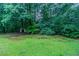 Expansive backyard featuring mature trees offering plenty of privacy at 604 Hamlet Se Ct, Conyers, GA 30094