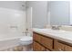Traditional bathroom features a shower over tub and vanity sink at 604 Hamlet Se Ct, Conyers, GA 30094