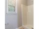 Cozy bathroom area with a bright window and a clean shower stall at 604 Hamlet Se Ct, Conyers, GA 30094