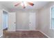 Bedroom featuring neutral paint, carpet, ceiling fan and a window at 604 Hamlet Se Ct, Conyers, GA 30094