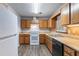 Functional kitchen with wood cabinets, modern appliances, and plenty of counter space at 604 Hamlet Se Ct, Conyers, GA 30094