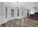 Bright dining room with bay windows and elegant chandelier at 6135 Stillwood Ln, Cumming, GA 30041
