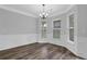Cozy dining area featuring natural light and decorative wainscoting at 6135 Stillwood Ln, Cumming, GA 30041