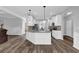 Bright kitchen with white cabinets, granite counters, and stainless steel appliances at 6135 Stillwood Ln, Cumming, GA 30041