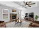 Inviting living room with coffered ceiling, fireplace, and comfortable seating at 6135 Stillwood Ln, Cumming, GA 30041