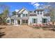 Charming two-story home with a manicured lawn and traditional architecture, perfect for Gathering living at 165 West Lake Blvd, Carrollton, GA 30116
