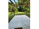 Concrete patio with a wooden pergola overlooks the well-maintained green lawn, ideal for outdoor relaxation at 2319 Beecher Sw Rd, Atlanta, GA 30311