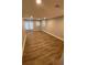 Finished basement with vinyl flooring, recessed lighting, and a walkout to the back yard at 2319 Beecher Sw Rd, Atlanta, GA 30311