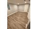 Finished basement space featuring wood-look flooring, neutral paint, and modern lighting fixtures at 2319 Beecher Sw Rd, Atlanta, GA 30311
