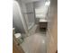Modern bathroom with tile flooring, new vanity, and updated fixtures at 2319 Beecher Sw Rd, Atlanta, GA 30311