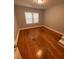 Bedroom featuring hardwood floors and natural light from a window at 2319 Beecher Sw Rd, Atlanta, GA 30311