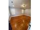 Bright bedroom features hardwood floors, fresh paint, and plantation shutters for natural light at 2319 Beecher Sw Rd, Atlanta, GA 30311