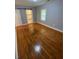 Bedroom featuring hardwood floors, a sliding closet door, and neutral paint at 2319 Beecher Sw Rd, Atlanta, GA 30311