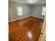 Bedroom with hardwood flooring and natural light at 2319 Beecher Sw Rd, Atlanta, GA 30311