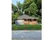 Charming single-story home features a welcoming front porch and a well-manicured lawn at 2319 Beecher Sw Rd, Atlanta, GA 30311