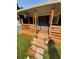 Welcoming porch boasts craftsman railings, decorative plants, and inviting curb appeal at 2319 Beecher Sw Rd, Atlanta, GA 30311