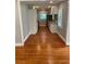 Open kitchen with hardwood floors, granite countertops, and ample cabinet space at 2319 Beecher Sw Rd, Atlanta, GA 30311