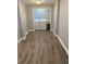 Hallway leading to a well-equipped laundry room with modern washer and dryer for convenience at 2319 Beecher Sw Rd, Atlanta, GA 30311