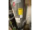 Close-up of Rheem water heater with Energy Guide label, highlighting its efficiency and energy saving at 2319 Beecher Sw Rd, Atlanta, GA 30311