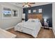 Stylish bedroom with a wooden headboard and an accent wall, creating a tranquil retreat at 4739 Lower Jersey Rd, Oxford, GA 30054