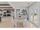 Open-concept dining area with modern table setting and abundant natural light, perfect for Gathering gatherings at 4739 Lower Jersey Rd, Oxford, GA 30054
