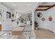 Stylish dining area flows into the kitchen, boasting shiplap accents and abundant natural light at 4739 Lower Jersey Rd, Oxford, GA 30054