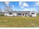 Charming single-story home boasts a modern metal roof, rocking chair front porch, and beautiful exterior at 4739 Lower Jersey Rd, Oxford, GA 30054