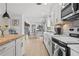 Well-appointed kitchen with white cabinets, modern appliances, and an open design, perfect for cooking and entertaining at 4739 Lower Jersey Rd, Oxford, GA 30054