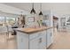 Kitchen island with counter seating provides a casual dining space and seamless transition into dining room at 4739 Lower Jersey Rd, Oxford, GA 30054