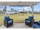 Relaxing patio with comfortable seating, perfect for enjoying the expansive backyard at 4739 Lower Jersey Rd, Oxford, GA 30054