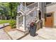 Exterior stairs with white railings and flower pots leading to the upper level of the home at 1268 Harris Road Rd, Lawrenceville, GA 30043