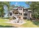 Spacious backyard featuring a patio with an outdoor seating and beautiful landscaping at 1268 Harris Road Rd, Lawrenceville, GA 30043