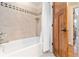 Bright bathroom features tiled shower and tub with glass enclosure, and modern fixtures at 1268 Harris Road Rd, Lawrenceville, GA 30043