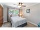 Bedroom with neutral carpet, trim and paint features a ceiling fan and double closet at 1268 Harris Road Rd, Lawrenceville, GA 30043