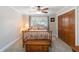 Charming bedroom with a ceiling fan, double windows and built-in closet storage at 1268 Harris Road Rd, Lawrenceville, GA 30043