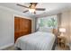 Bedroom with neutral carpet, trim and paint features a ceiling fan and double closet at 1268 Harris Road Rd, Lawrenceville, GA 30043