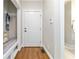 Entryway features a built in bench and coat rack, and a white front door at 1268 Harris Road Rd, Lawrenceville, GA 30043