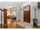 Welcoming entryway with hardwood floors, a wooden door, and a glimpse of the living room at 1268 Harris Road Rd, Lawrenceville, GA 30043
