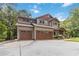 Stunning two-story home with a spacious driveway, a two-car garage, and beautifully landscaped front yard at 1268 Harris Road Rd, Lawrenceville, GA 30043