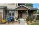 Charming house with a covered front porch, stone pillars, and beautiful flower beds at 1268 Harris Road Rd, Lawrenceville, GA 30043