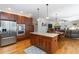 Spacious kitchen featuring stainless appliances, granite counters, and seamless flow to living area at 1268 Harris Road Rd, Lawrenceville, GA 30043