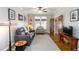 Living room features a sofa, chair, windows and hardwood floors at 1268 Harris Road Rd, Lawrenceville, GA 30043
