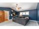 Modern living room with vaulted ceiling, shelving, and comfortable seating area at 1268 Harris Road Rd, Lawrenceville, GA 30043