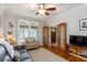 Living room features a sofa, chair, windows and hardwood floors at 1268 Harris Road Rd, Lawrenceville, GA 30043