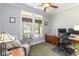 Home office features a desk area, windows, hardwood floors and a ceiling fan at 1268 Harris Road Rd, Lawrenceville, GA 30043