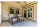 Cozy patio with comfortable seating, decorative pillows, and a small table at 1268 Harris Road Rd, Lawrenceville, GA 30043